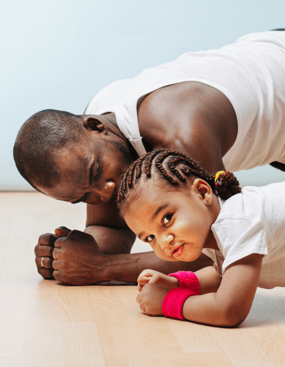 Man and son doing press up fun