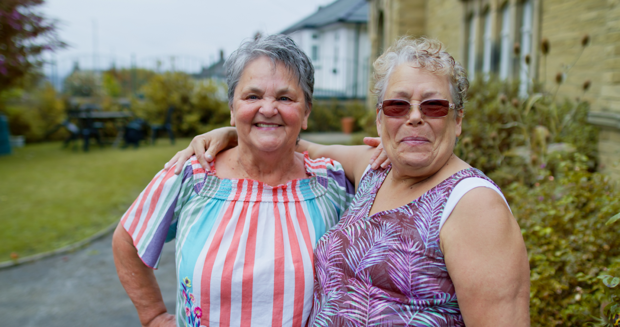 Two mature women laughing together
