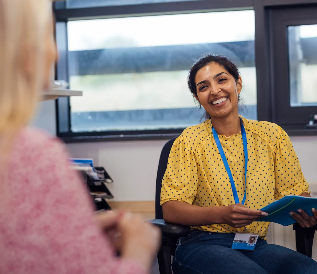 Health professional in consultation with a patient